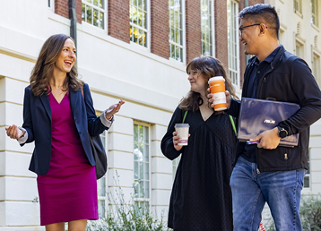 photo of faculty interacting with graduate students